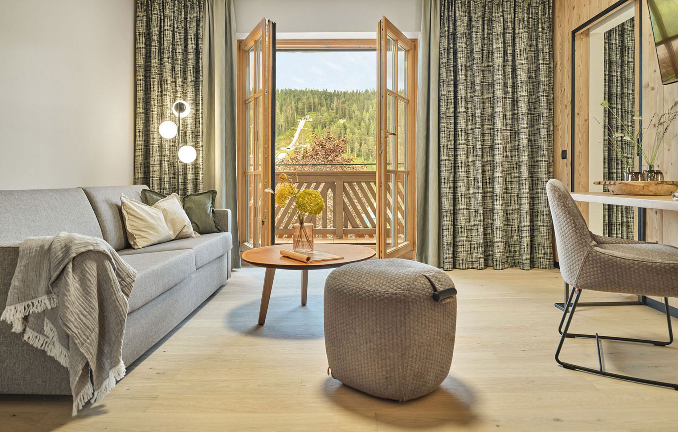 Cosy living room at Hotel Matschner with a view of the mountains